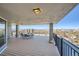 Expansive outdoor balcony with dining set and city views extending to the snow-capped mountain range at 1085 N Lafayette St # 804, Denver, CO 80218