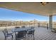 Outdoor balcony with seating and expansive city views extending to the mountain range at 1085 N Lafayette St # 804, Denver, CO 80218