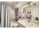 Well-lit bathroom featuring modern fixtures, neutral color palette, stylish décor, and tile backsplash at 1085 N Lafayette St # 804, Denver, CO 80218