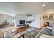 Inviting living room and dining area with hardwood floors, contemporary furnishings, and abundant natural light at 1085 N Lafayette St # 804, Denver, CO 80218