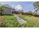 View of a tiered backyard with a large deck and covered patio, perfect for outdoor entertaining at 2452 S Norfolk St, Aurora, CO 80013