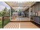 Entertain on the well-appointed backyard deck, featuring an outdoor kitchen and lounge area at 2452 S Norfolk St, Aurora, CO 80013
