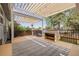 The covered deck features an outdoor kitchen and a spacious lounge area perfect for parties at 2452 S Norfolk St, Aurora, CO 80013
