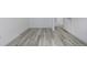 A bedroom with grey wood plank flooring and white trim at 2452 S Norfolk St, Aurora, CO 80013