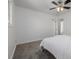 Bright and airy bedroom featuring gray carpeting, a ceiling fan, and white paint at 2452 S Norfolk St, Aurora, CO 80013