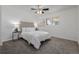 Comfortable bedroom featuring neutral colors, plush carpeting, and plenty of natural light from the windows at 2452 S Norfolk St, Aurora, CO 80013