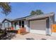 Charming single Gathering home with attached garage, landscaped yard, and solar panels on the roof at 2452 S Norfolk St, Aurora, CO 80013