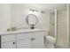 Modern bathroom with a glass door shower, contemporary lighting, and a large white sink at 17794 E Bellewood Dr, Aurora, CO 80015