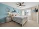 Bright bedroom featuring a comfortable queen-sized bed, a ceiling fan, and natural light at 17794 E Bellewood Dr, Aurora, CO 80015