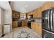 Beautiful kitchen featuring wooden cabinetry, granite countertops, and stainless steel appliances at 17794 E Bellewood Dr, Aurora, CO 80015