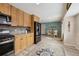 Open kitchen view leads to a cozy breakfast nook, connecting cooking and dining spaces seamlessly at 17794 E Bellewood Dr, Aurora, CO 80015