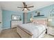 A bright main bedroom with a decorative stone pillar, a ceiling fan, and a light wood furniture set at 17794 E Bellewood Dr, Aurora, CO 80015