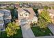 Stunning aerial view of a two-story home in a well-planned neighborhood on a sunny day at 9294 Melborne Ct, Parker, CO 80134