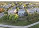 Aerial view of a neighborhood with mature trees and well-maintained lawns at 9294 Melborne Ct, Parker, CO 80134