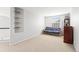 Bright bedroom with a cozy futon and a decorative shelving unit at 9294 Melborne Ct, Parker, CO 80134
