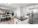 Spacious kitchen with island seating that is open to the living room at 9294 Melborne Ct, Parker, CO 80134