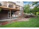 Charming backyard featuring a patio, deck, waterfall feature, and lush landscaping at 2959 W 110Th Pl, Westminster, CO 80234