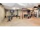 Finished basement with exercise equipment, carpet, and a television at 2959 W 110Th Pl, Westminster, CO 80234