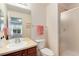 Bathroom featuring a shower, a large mirror, and a single sink vanity at 2959 W 110Th Pl, Westminster, CO 80234