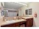 Bathroom features dual sinks, vanity lighting, and a large mirror at 2959 W 110Th Pl, Westminster, CO 80234