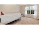 Bright bedroom featuring a window with a view of the greenery outside at 2959 W 110Th Pl, Westminster, CO 80234