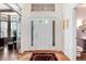 Bright foyer with hardwood floors, white trim, transom window, and a view of the study at 2959 W 110Th Pl, Westminster, CO 80234