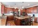 The open kitchen boasts stainless steel appliances, a central island, and ample storage at 2959 W 110Th Pl, Westminster, CO 80234