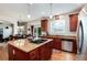 This kitchen boasts an island cooktop, stainless steel appliances, and ample counter space at 2959 W 110Th Pl, Westminster, CO 80234