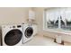 Convenient laundry room features a sink and plenty of natural light from the large window at 2959 W 110Th Pl, Westminster, CO 80234