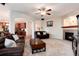 Inviting living room boasts a cozy fireplace and seamless access to the kitchen area at 2959 W 110Th Pl, Westminster, CO 80234