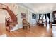 View of the dining room and the living room featuring hardwood floors, large windows and staircase at 2959 W 110Th Pl, Westminster, CO 80234