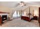 Relaxing primary bedroom suite with vaulted ceilings and a cozy fireplace at 2959 W 110Th Pl, Westminster, CO 80234