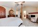 Large primary bedroom with a fireplace and en suite bathroom at 2959 W 110Th Pl, Westminster, CO 80234