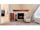 Cozy bedroom nook showcasing a tiled fireplace and comfortable seating at 2959 W 110Th Pl, Westminster, CO 80234