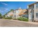 Attractive townhouse with neutral siding, dormer windows, and manicured front yard at 7978 Chase Cir # E, Arvada, CO 80003