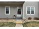 Charming entryway with wreath-adorned door, stone landscaping, and visible unit number at 2301 E Fremont Ave # W02, Centennial, CO 80122