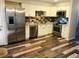 Modern kitchen featuring stainless steel appliances, white cabinets, and eye-catching backsplash at 2301 E Fremont Ave # W02, Centennial, CO 80122