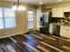 Dining Area with stainless steel refrigerator, plank flooring and lots of natural light at 2301 E Fremont Ave # W02, Centennial, CO 80122