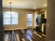 Dining Area with stainless steel refrigerator, plank flooring and lots of natural light at 2301 E Fremont Ave # W02, Centennial, CO 80122