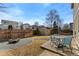 Landscaped backyard features a fire pit, patio set, shed and wooden fence at 6280 Snowberry Ave, Firestone, CO 80504