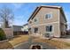 Back of the house showing the backyard with patio, firepit, and shed at 6280 Snowberry Ave, Firestone, CO 80504