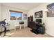 Neutral bedroom with a desk, PC setup, and plenty of natural light at 6280 Snowberry Ave, Firestone, CO 80504