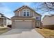 Exterior view of a two-story home with a two-car garage and neutral-toned siding at 6280 Snowberry Ave, Firestone, CO 80504