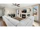 Cozy living room with a fireplace, built-in shelving, and comfortable seating at 6280 Snowberry Ave, Firestone, CO 80504