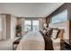 A serene main bedroom with ample natural light and modern decor at 17153 W 91St Ln, Arvada, CO 80007