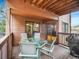 Relax on this covered back deck with outdoor seating and a grill, perfect for entertaining at 23485 Bluestem Dr, Golden, CO 80401