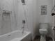 Bright bathroom with a marble-tiled shower/tub combination and modern fixtures at 23485 Bluestem Dr, Golden, CO 80401
