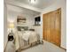 Comfortable bedroom featuring a cozy bed, soft lighting, and closet at 23485 Bluestem Dr, Golden, CO 80401