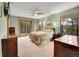 Spacious bedroom with en-suite bathroom access and view from the big windows at 23485 Bluestem Dr, Golden, CO 80401