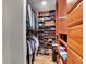 Organized walk-in closet with custom shelving, drawers, and ample storage space for clothing and accessories at 23485 Bluestem Dr, Golden, CO 80401